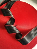 Premium red and black car seatbelt replacement webbing for luxury auto interior styling in Morocco.